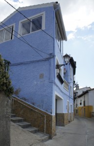 Blue House and alley to the left