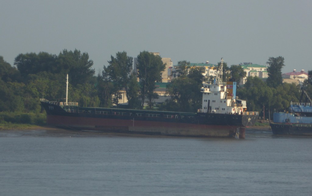 beached ship on North Korean side of the river